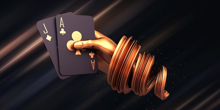 zlatna ruka luksuzne kasino karte poker blackjack baccarat i žetoni zlatne kocke